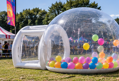 The Bubble at a funfair filled with vibrant balloons and carnival stalls in the background
