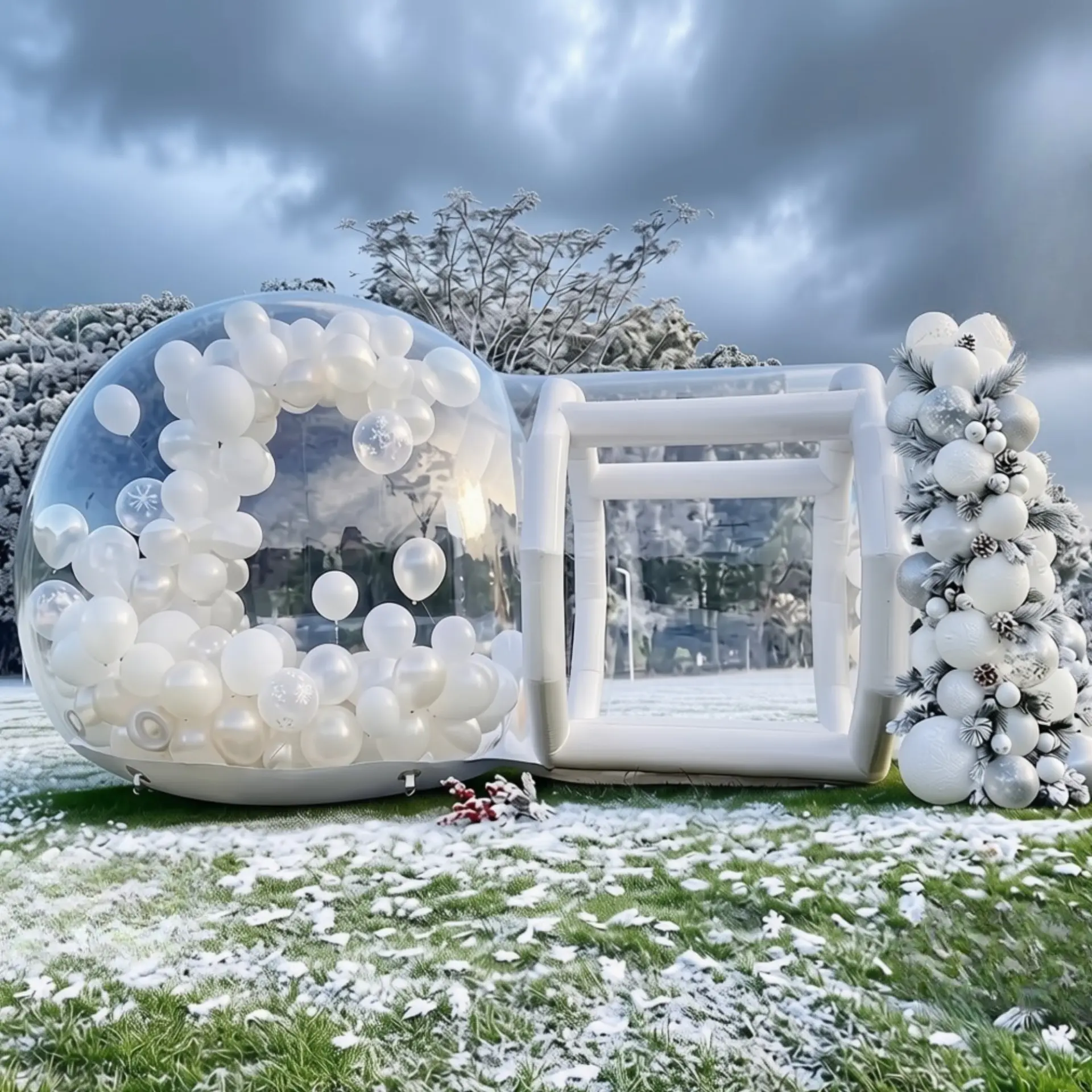 The Bubble inflatable dome decorated with white and silver winter balloons and festive garlands in a snowy outdoor setting