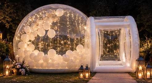 The Bubble glowing at an evening event with fairy lights, lanterns and white balloons